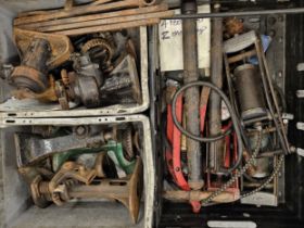 Assorted vintage car jacks and foot pumps.