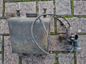 A vintage carb and oil tank