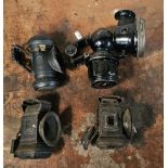 Two Powell & Hanmer bicycle acetylene lamps, and two other lamps.