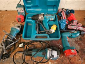 A Makita drill 8411D, two head torches, two 240V angle grinders, all working and an untested 110v