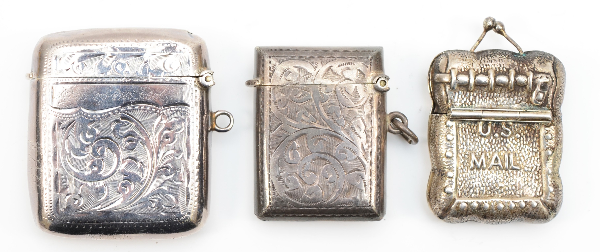 An American sterling silver stamp case in the form of a U.S Mail satchel, 38 x 31mm, together with - Image 2 of 2