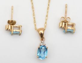 A 9k blue topaz and diamond pendant, 14mm, on chain, and matching ear studs, 2.3gm.