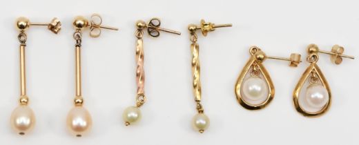 Three pairs of 9ct gold cultured pearl drop earrings, longest 28mm, 5gm.