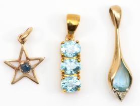 Two 9ct gold topaz pendants, 23mm, together with a 9ct gold sapphire star pendant, combined 2.6gm.