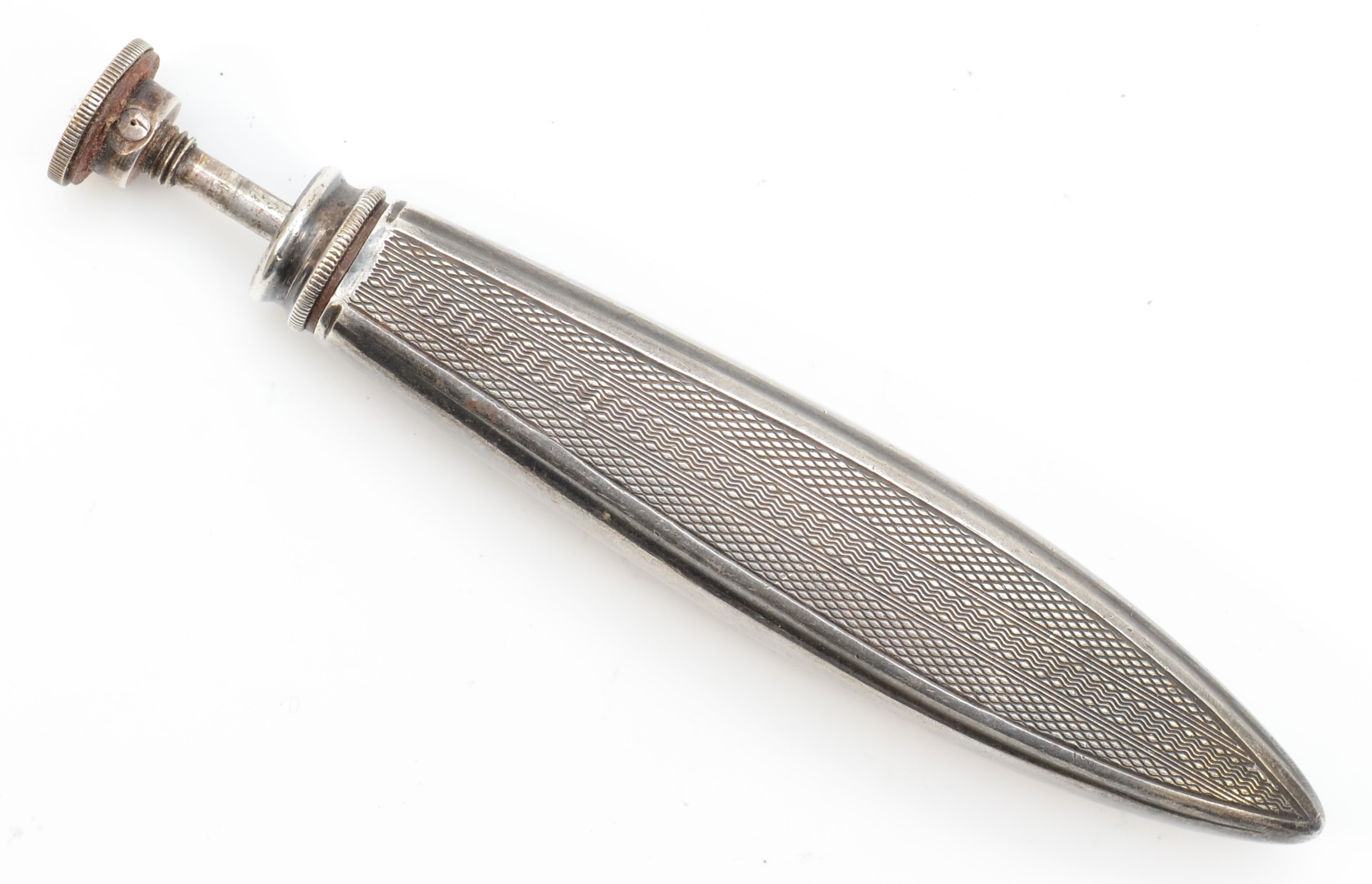 An Art Deco unmarked silver atomizer with engine turned decoration, 9.5cm, 41gm.
