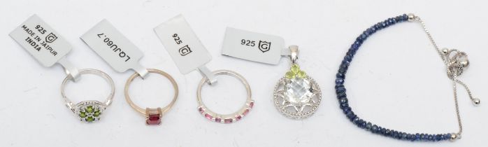 A group of plated and silver jewellery to include rings and pendant.