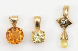 Two 9ct gold citrine pendants, 20mm, 10mm, 2.1gm, also with another citrine pendant.