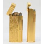 Dunhill, Two textured gold plated gas lighters, No E30436, No 019.