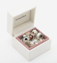 Pandora, ten silver charms to include a Christmas sled example, 32gm.