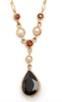 A 9ct gold garnet and seed pearl drop necklace, 22mm, 3gm.