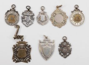 Eight silver watch fobs to include two Nottingham Institutes Association examples, 92gm.
