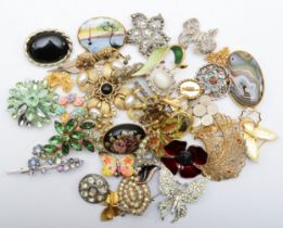 A collection of modern brooches to include animal examples.