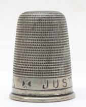 A metal 'Just a thimbleful' tot cup, 5 x 4cm.