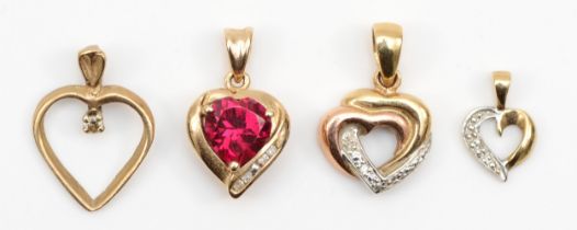 A gold synthetic ruby heart shaped pendant, 17mm, stamped 375, together with three other 9ct gold