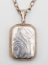 A vintage silver rectangular locket with scroll decoration, 42 x 23mm, on chain, 20gm.