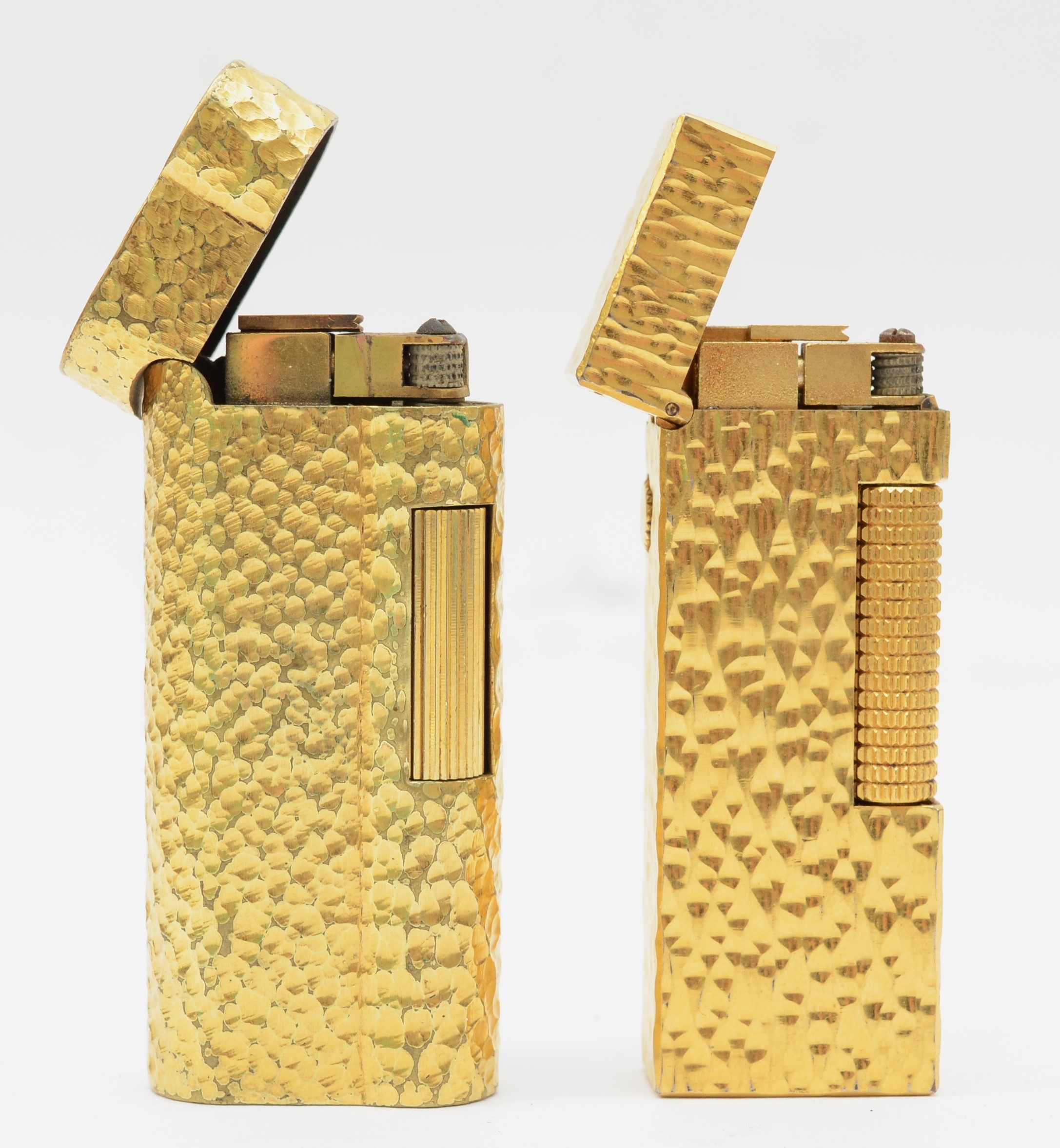 Dunhill, two textured gold plated gas lighters, 074602, 24163.