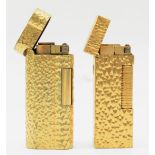 Dunhill, two textured gold plated gas lighters, 074602, 24163.