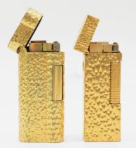 Dunhill, two textured gold plated gas lighters, 074602, 24163.
