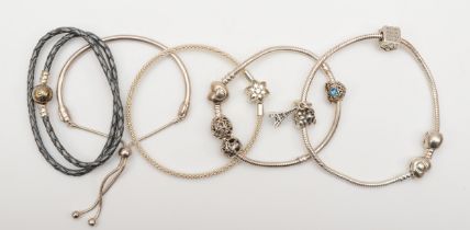 Pandora, five silver bracelets to include a leather example, 78gm.