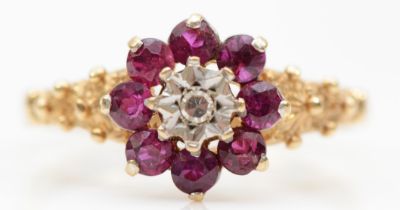 A 9ct gold ruby and eight cut illusion set diamond cluster ring, O-P, 2gm.