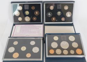 Five Royal mint proof coin sets, 1984, 1985, 1988, 1997 and a 2000 set.