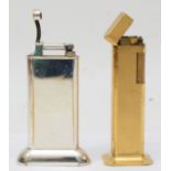 Dunhill, A textured gold plated 'Tallboy' gas table lighter, 11cm, and another chrome plated Dunhill