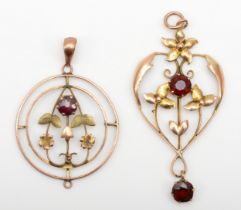 An Edwardian 9ct gold garnet openwork pendant, 35 x 22mm, with another 9ct gold example, 3.1gm.