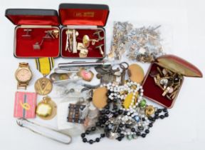 A collection of mixed items to include watch link parts, medals and cuff links.