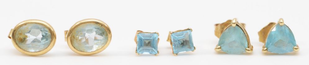 Two pairs of gold topaz ear studs, stamped 375 and 10k, 1.6, together with a pair of unmarked