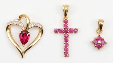 A gold ruby heart shaped pendant, 20 x 16mm, stamped 10k, a 9ct gold ruby cross and a ruby