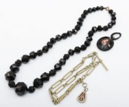 A Victorian Whitby jet beaded necklace and pendent, with a base metal watch chain.