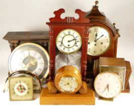 A collection of mid 20th century and later mantel clocks, wall clocks and carriage clocks, having