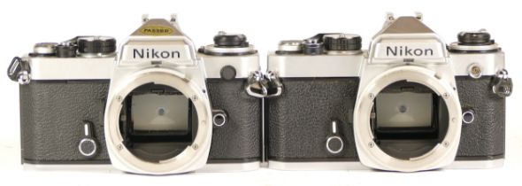 Two Nikon digital camera bodies comprising of Nikon FE3683949 (working) and Nikon FE4235868 (boxed