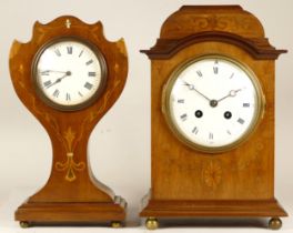 A late 19th century French inlaid mahogany mantel clock, having an eight day movement striking on