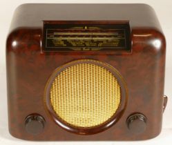 A 20th century Bush DAC 90A Bakelite cased radio, with twin adjustable circular knobs, 29cm wide