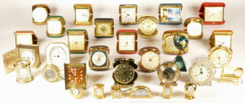 A collection of mid 20th century and later mantel clocks, miniature novelty clocks, traveling