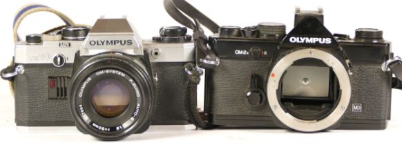 An Olympus OM10 camera complete with lens (working nut lens requires a strip clean) together with an