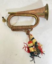 A 20th century copper and brass bugle, 29cm long