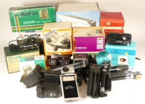 Assortment of camera accessories and lighting equipment