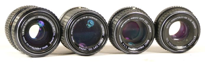 Four assorted Pentax lens comprising SMC Pentax-M 1:3.5 135mm, SMC Pentax-M 1:2 50mm, SMC Pentax-M-