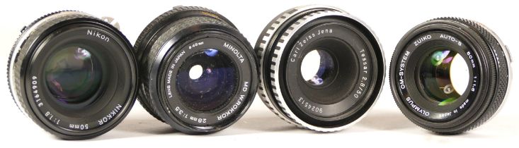 Four assorted camera lenses comprising of Minolta MD W.Rokkor 28mm 1:3.5 49mm lens