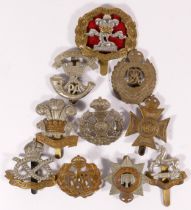 Ten military cap badges, including South Lancs and South Staffs