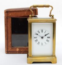 A 20th century brass corniche cased and four glass carriage clock, with swing handle, the white dial