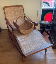 A contemporary teak framed and wicker steamer chair