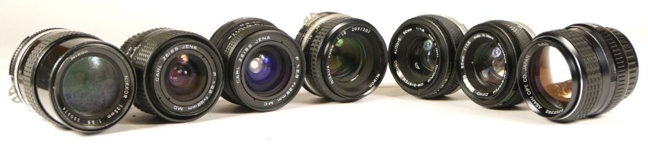 Seven assorted lenses to include Pentax 85mm lens (working with dust specks and faint haze),