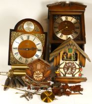 A collection of mid 20th century wall clocks together with cuckoo clocks, having manual wind