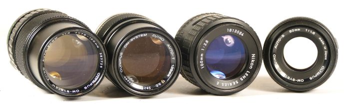 Four assorted camera lens to include three Olypus camera lenses (mechanically working but require