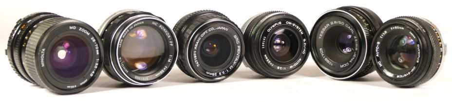 Six assorted camera lenses comprising of Carl Zeiss Jena Tessar 2.8/50, Pentax-M 1:3.5 28mm