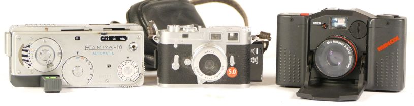 A Minox Leica MC Plus camera, together with various accessories