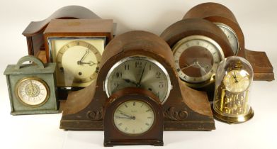 A collection of mid 20th century and later mantel clocks, wall clocks and carriage clocks, having